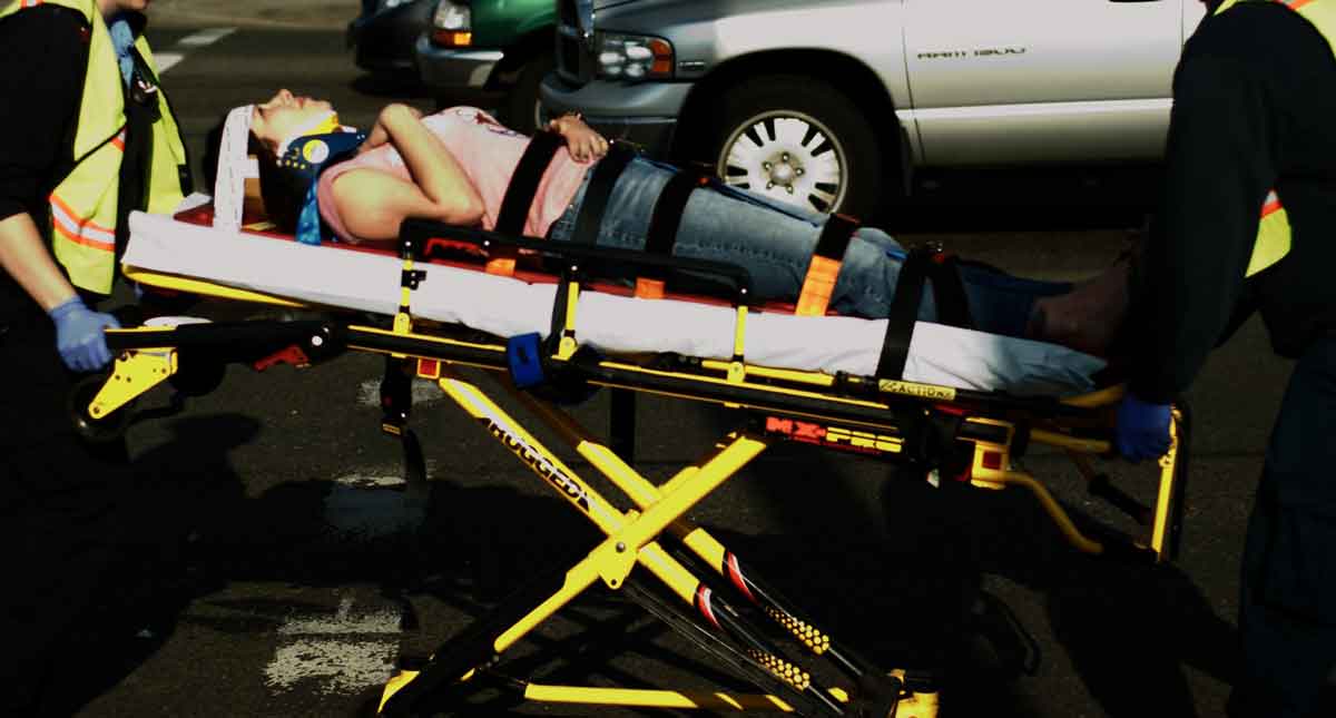 Injured person going in an ambulance, Dallas Personal Injury Lawyer