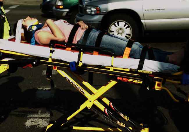 Woman on backboard injured