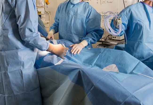 Surgeons in middle of operation