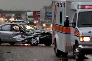 Wrecked car against curb, Lewisville Car Accident Lawyer