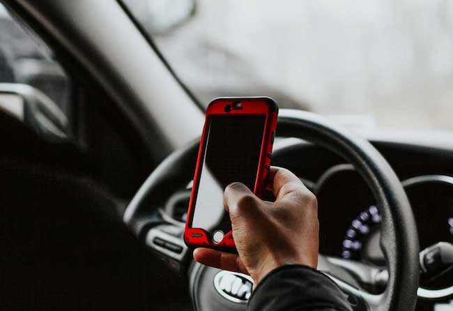 Person using cellphone while driving